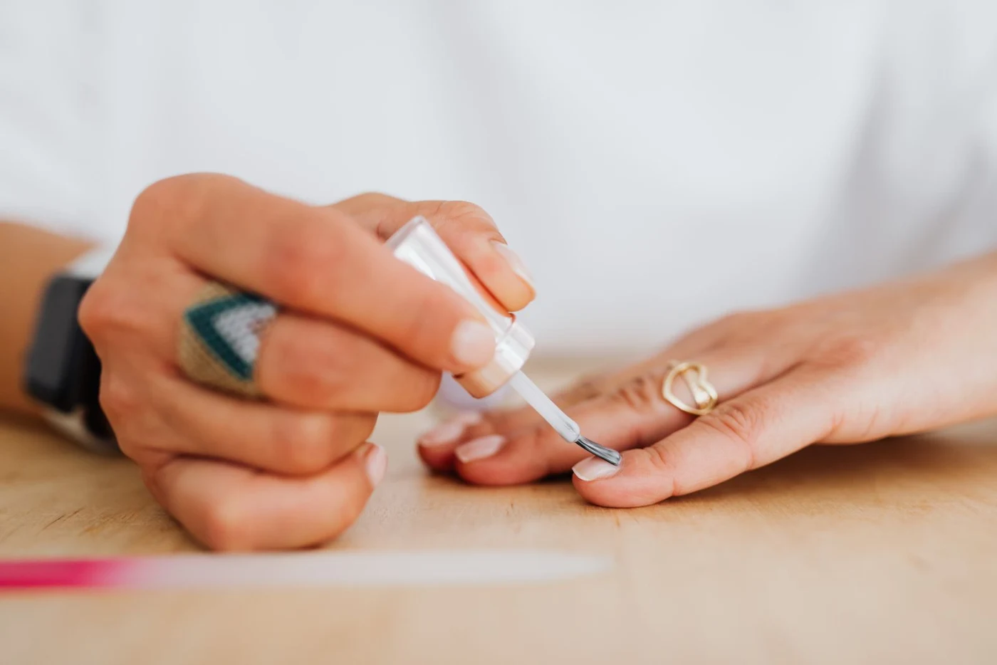 Nail artist carefully applying polish