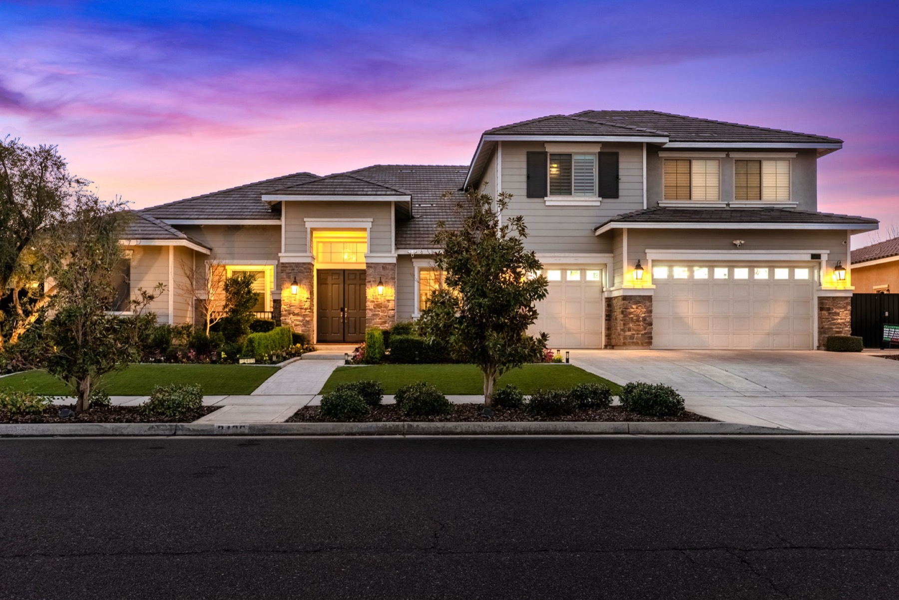 Two-story home with twilight sky